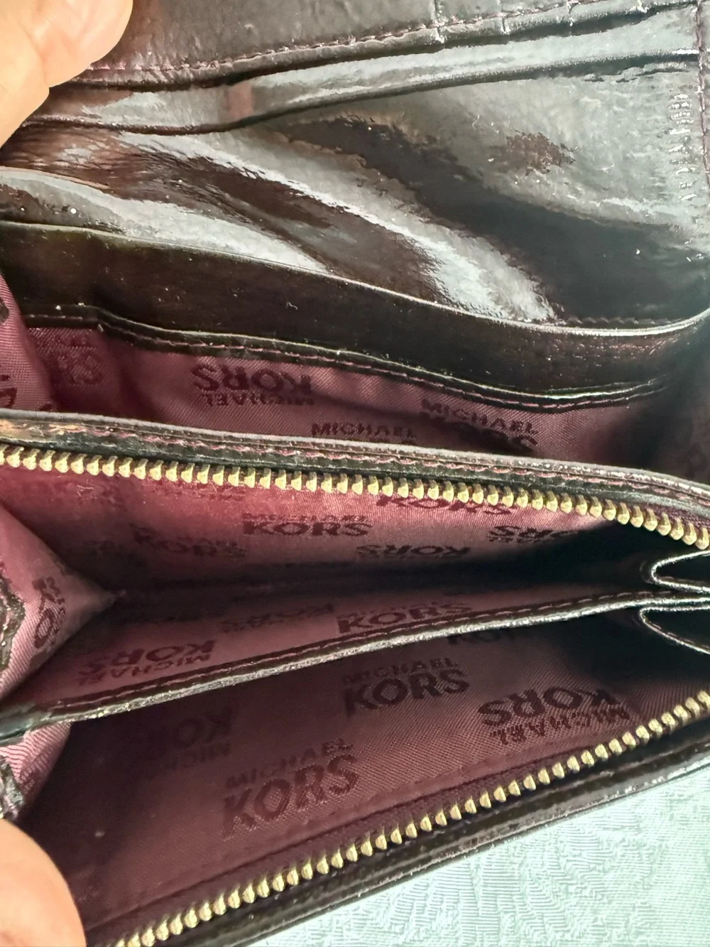 Michael Kors Burgundy patent bifold wallet with Gold Studs